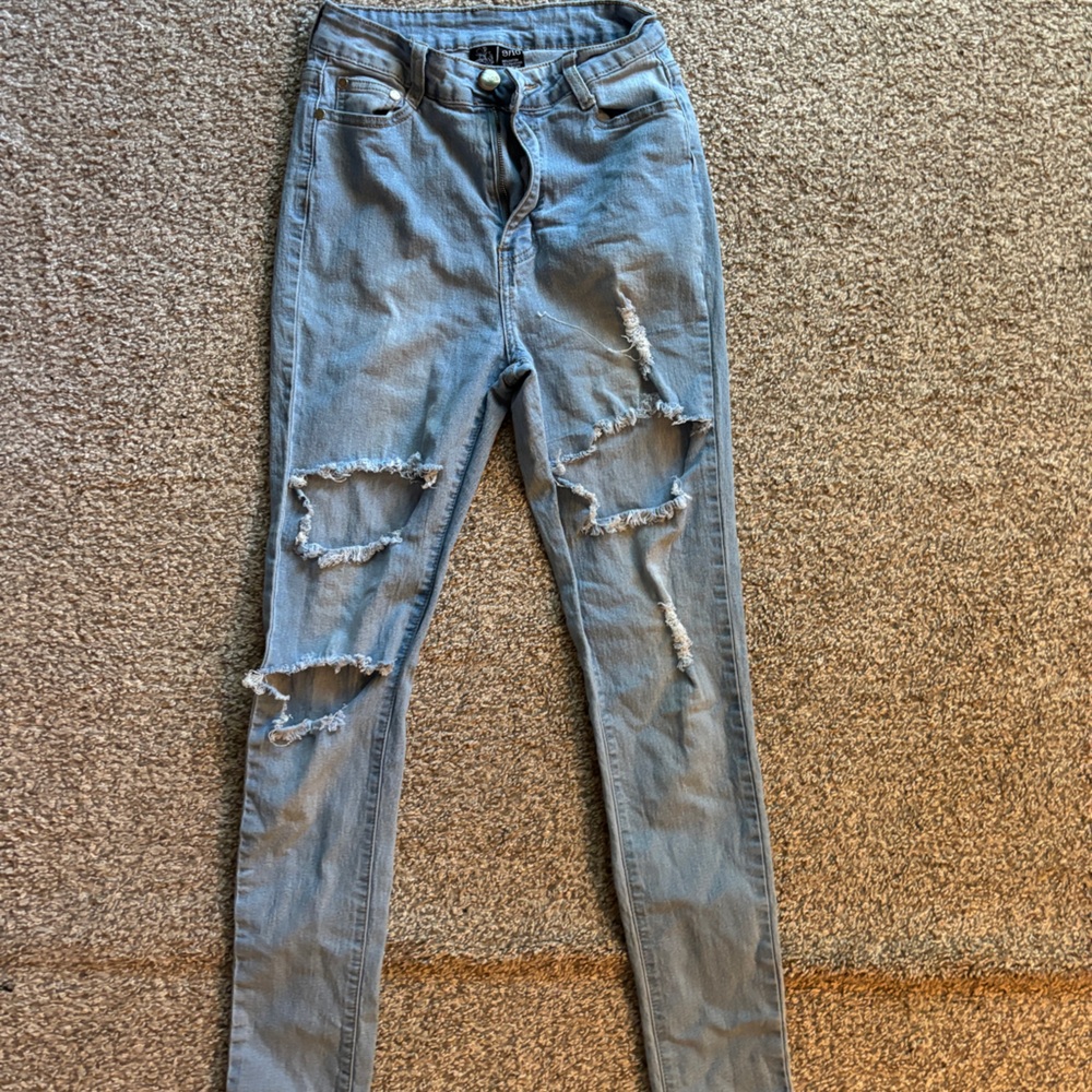 Blue jeans, ripped.